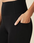 model wears sculpting black pocket leggings