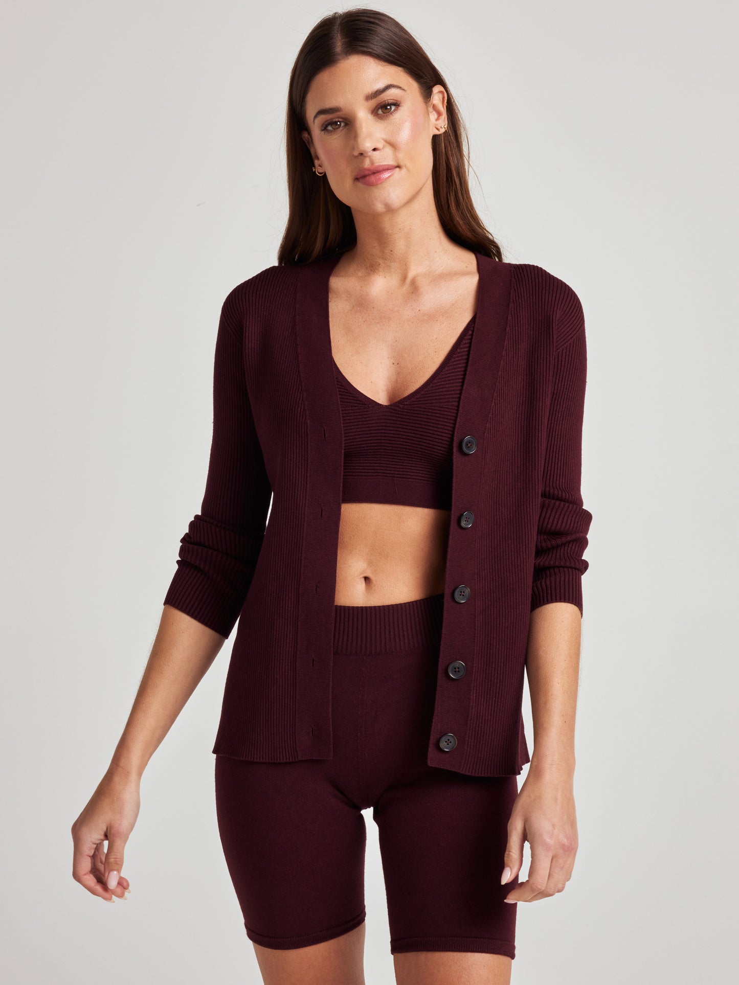 model wears cozy rib knit cardigan in burgundy