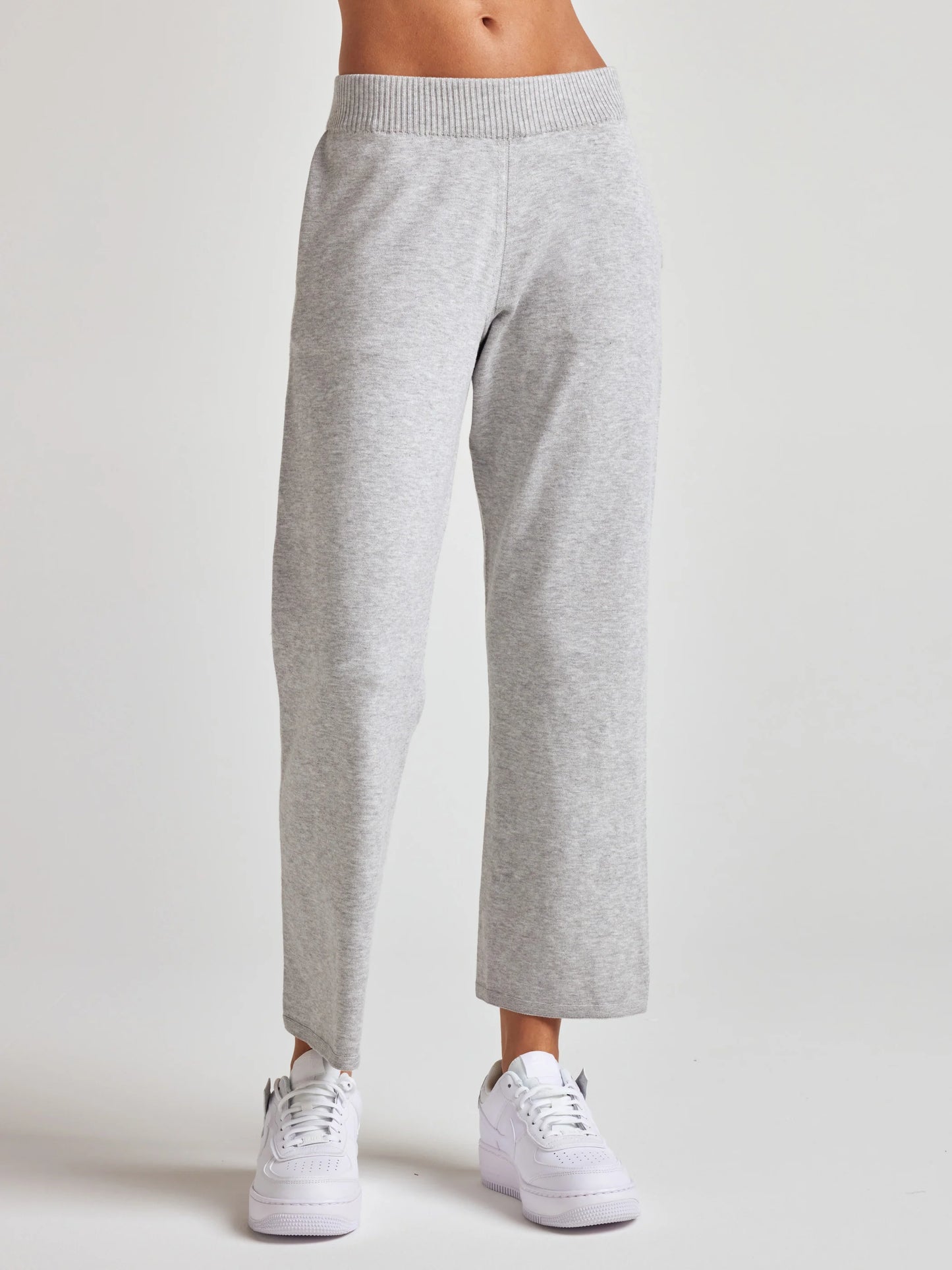 model wears sustainable cropped grey knit pants