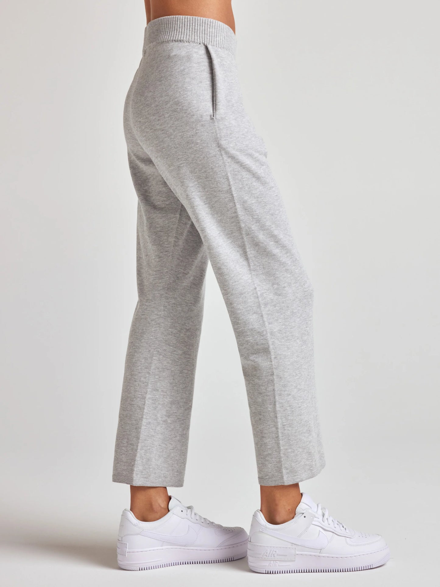 model wears sustainable cropped grey knit pants