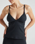 Model wears black rib triangle tank with built in bra