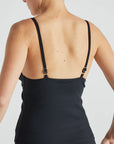 Model wears black rib triangle tank with built in bra