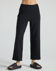 model wears black wide leg relaxed rib cropped pant