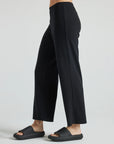 model wears black wide leg relaxed rib cropped pant
