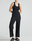 model wears black wide leg relaxed rib cropped pant