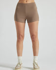 model wears light brown 3 inch inseam rib shorts
