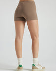 model wears light brown 3 inch inseam rib shorts
