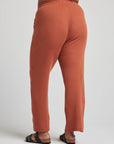 model wears relaxed waffle knit pants in baked clay