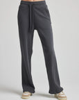 model wears relaxed waffle knit pants in charcoal