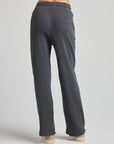 model wears relaxed waffle knit pants in charcoal