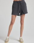 model wears retro waffle knit gym shorts in charcoal