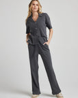 model poses in charcoal thermal button down with seashell buttons
