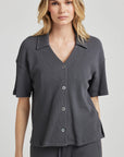 model poses in charcoal thermal button down with seashell buttons