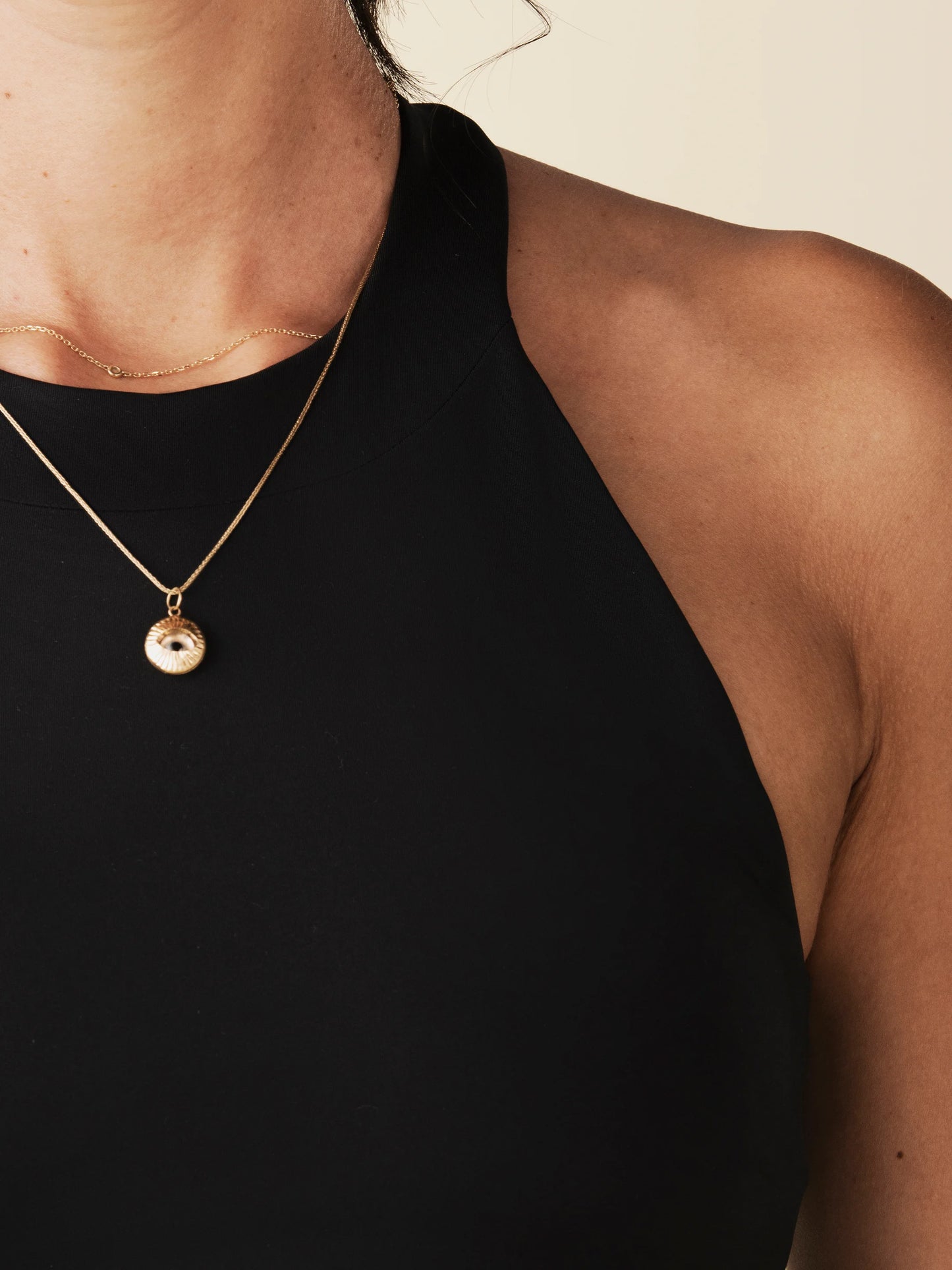model wears black racerback tank with built in bra