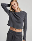 model wears organic thermal long sleeve in grey