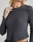 model wears organic thermal long sleeve in grey