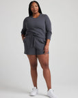 model wears organic thermal long sleeve in grey
