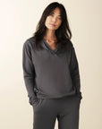 model wears cozy grey v neck hoodie