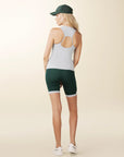 model wears green biker shorts with deep pockets