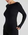 model wears black boat neck long sleeve