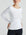 model wears white boat neck long sleeve