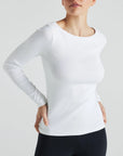 model wears white boat neck long sleeve