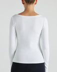 model wears white boat neck long sleeve