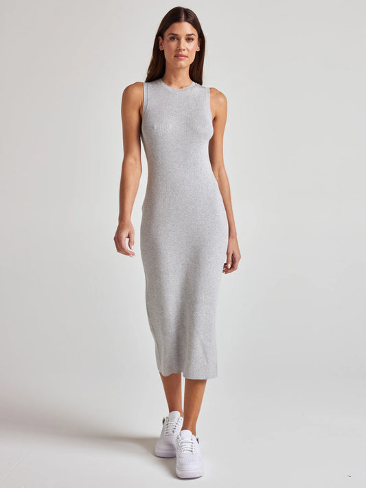model wears sustainable grey knit midi dress