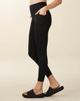 Model wears full length crossover deep pocket leggings in black