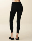 Model wears full length crossover deep pocket leggings in black