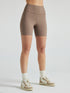 Model wears sustainable light brown nylon rib biker shorts