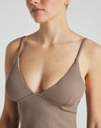 Model wears light brown rib triangle tank with built in bra