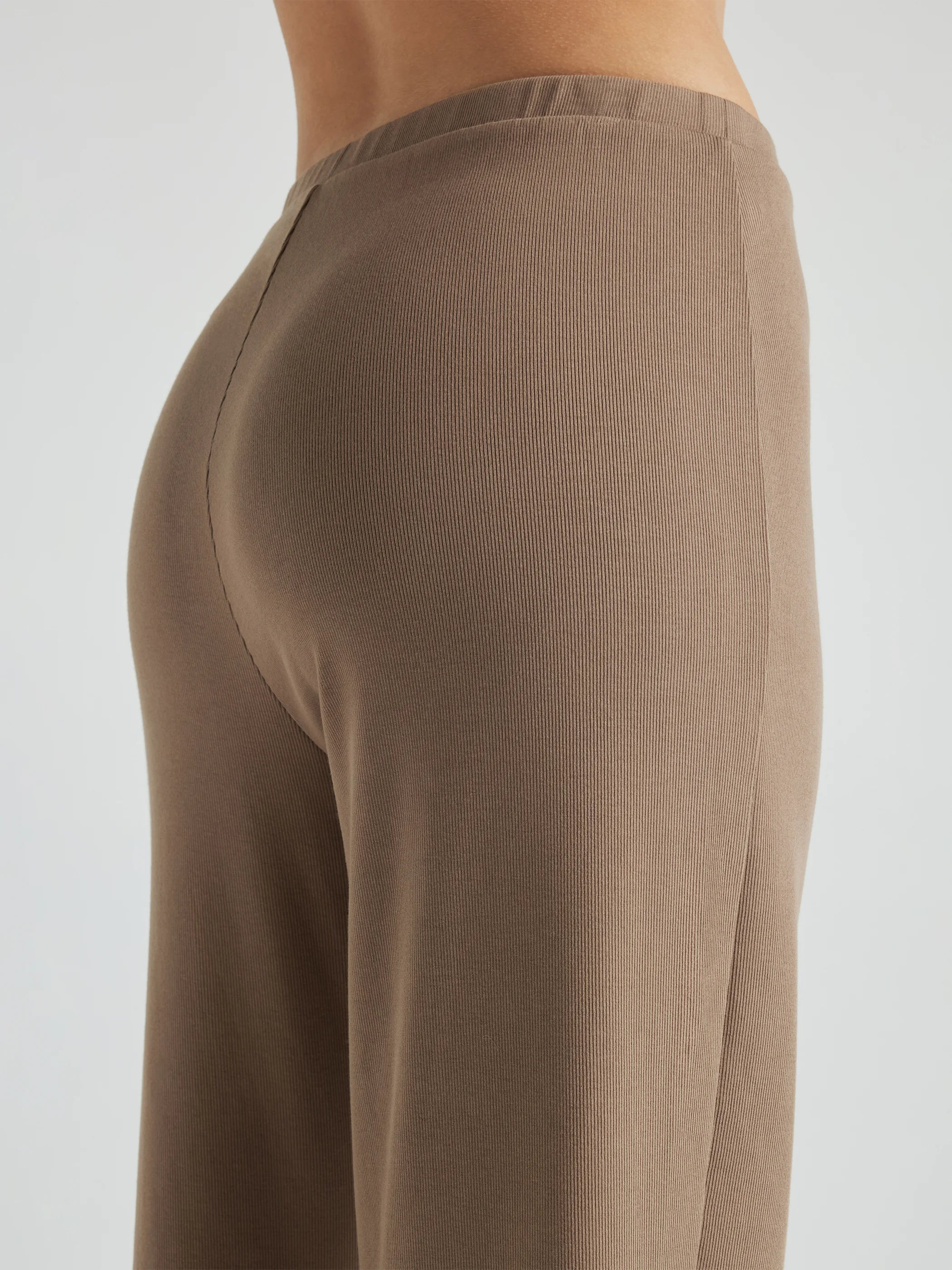model wears light brown wide leg relaxed rib cropped pant