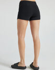 model wears black 3 inch inseam rib shorts