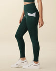 Model wears full length crossover deep pocket leggings in green and light blue