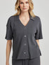 model poses in charcoal thermal button down with seashell buttons