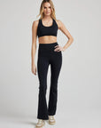 model wears sculpting bootcut flare legging in black