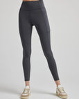 model wears sculpting grey pocket leggings