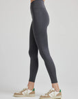 model wears sculpting grey pocket leggings