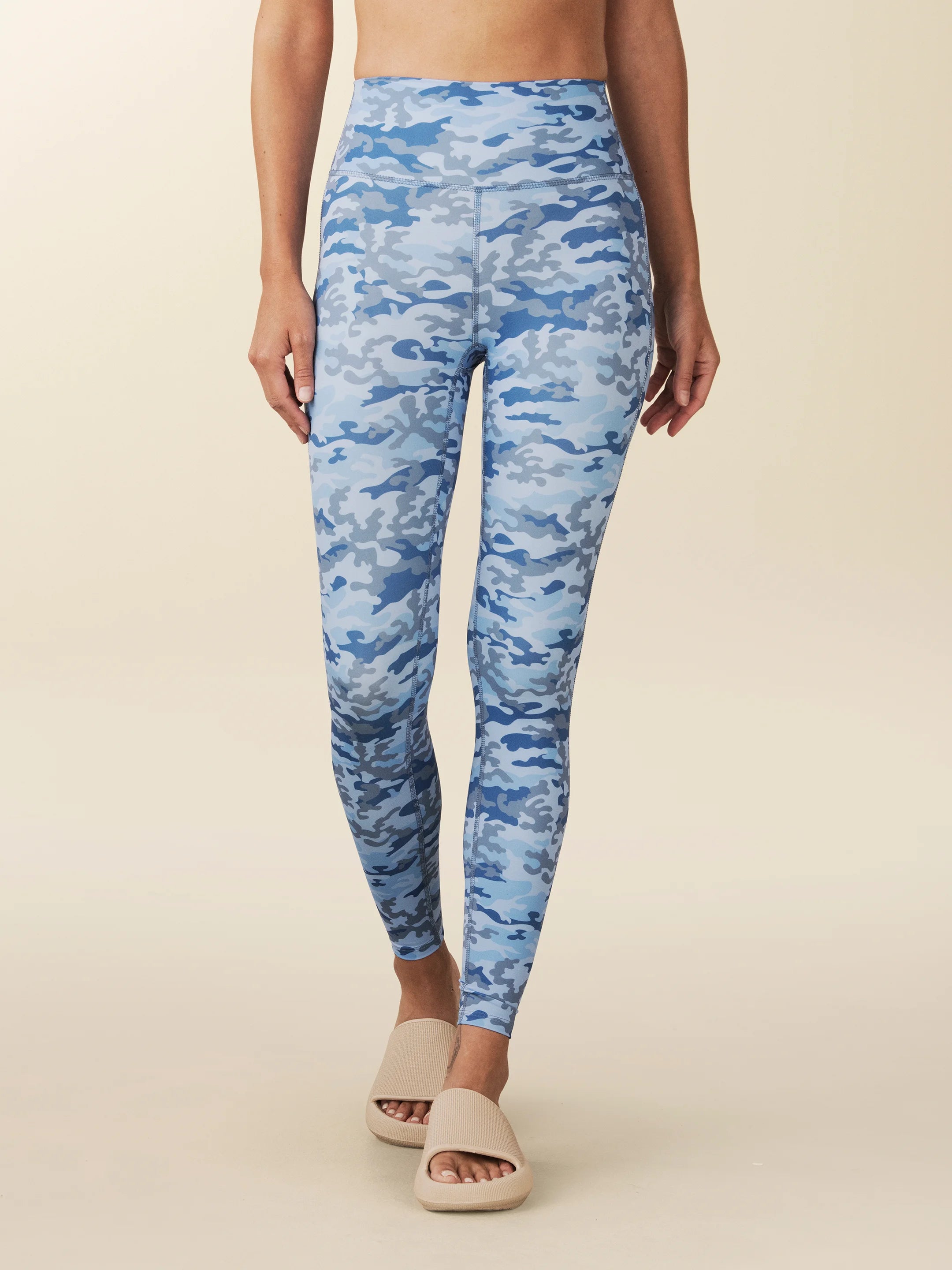 model wears blue Camo full length leggings