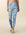 model wears blue Camo full length leggings