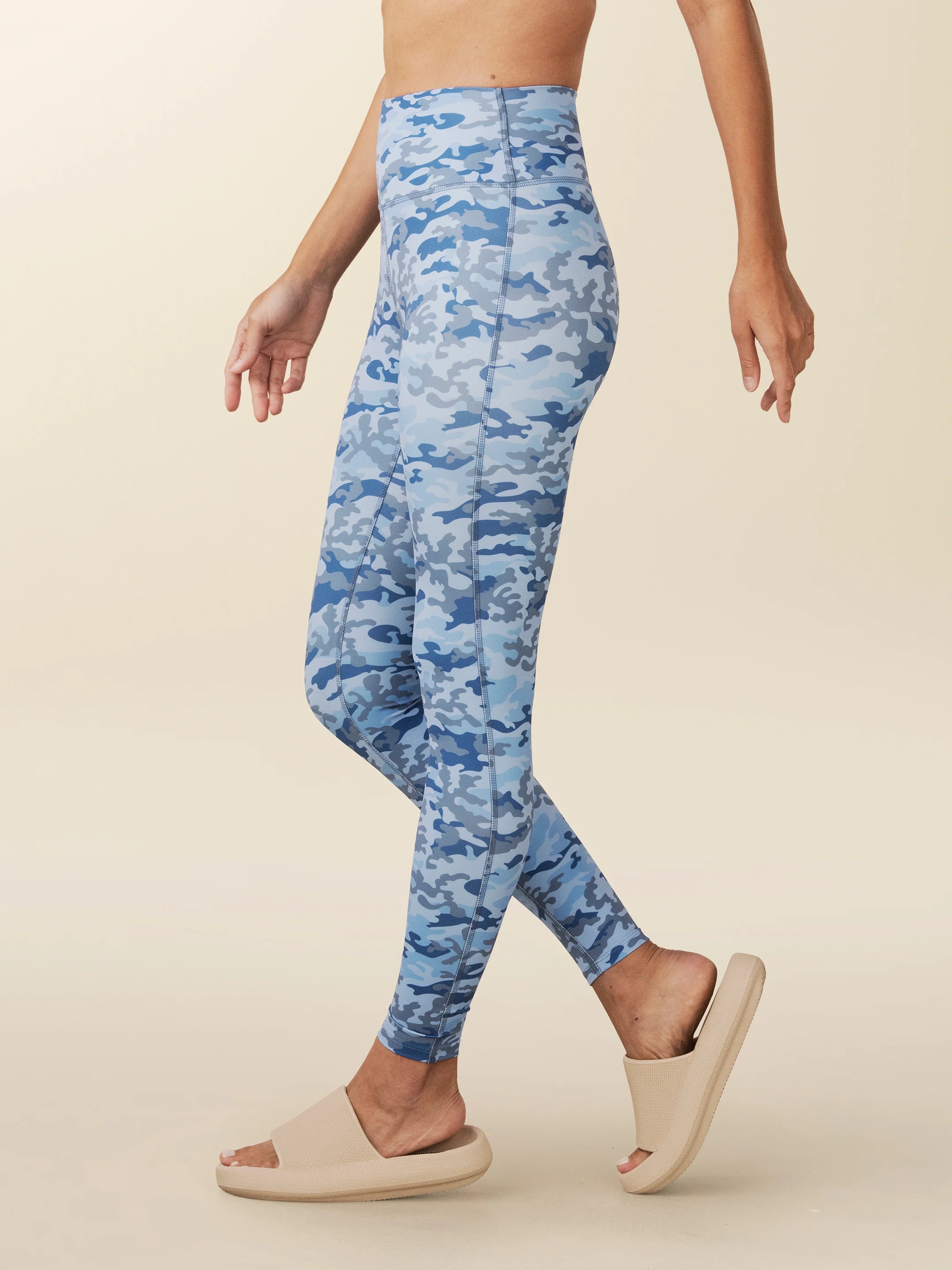 model wears blue Camo full length leggings