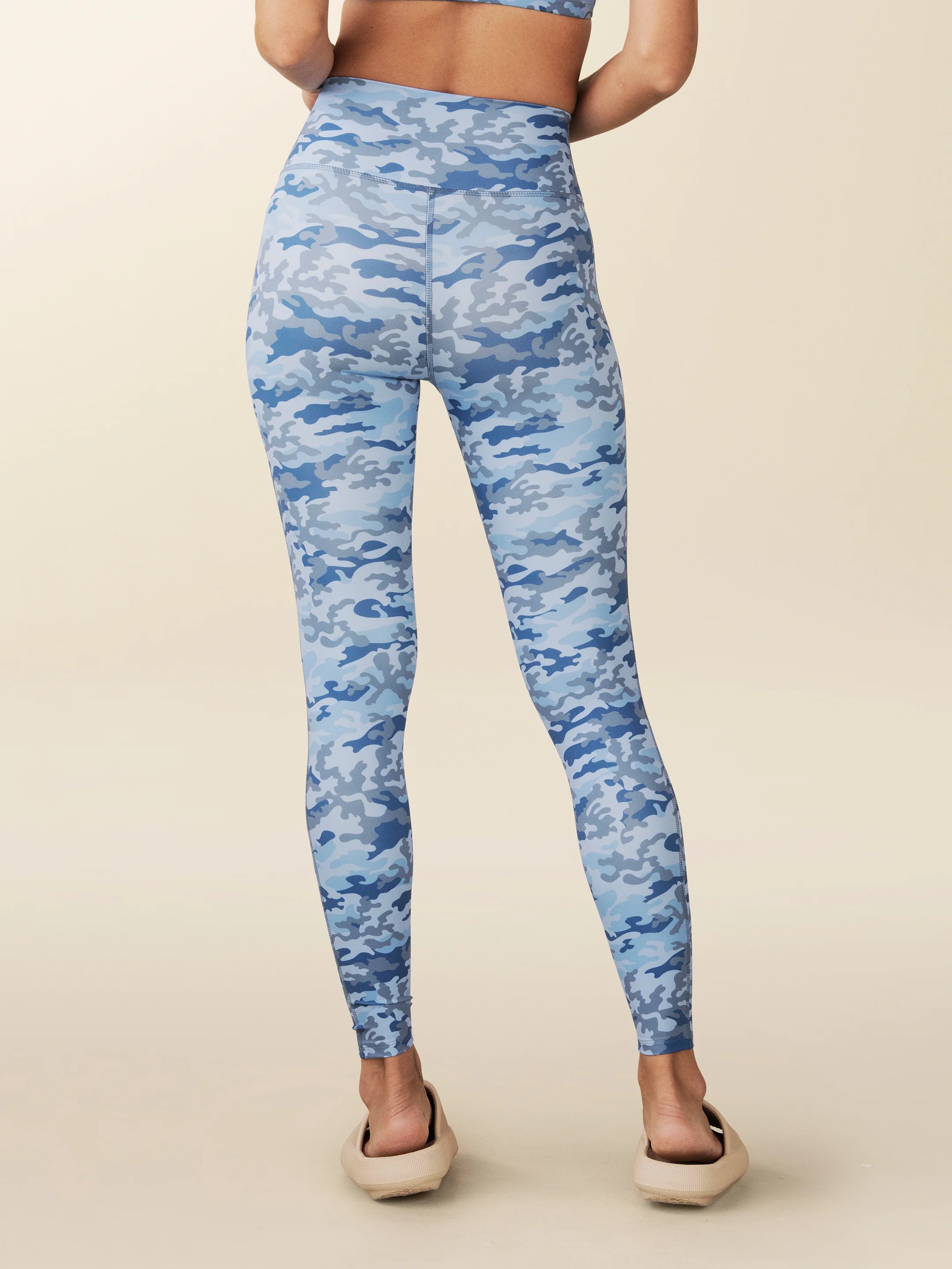 model wears blue Camo full length leggings