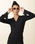 model wears cozy v-neck top with slit in black