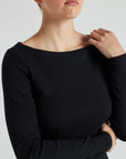 model wears black boat neck long sleeve