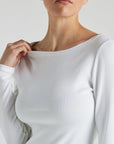 model wears white boat neck long sleeve
