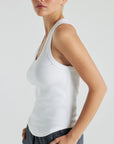 Model wears white luxury ribbed tank