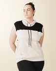 model wears cream colorblock sleeveless hoodie