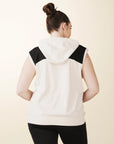 model wears cream colorblock sleeveless hoodie