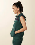 model wears green colorblock sleeveless hoodie